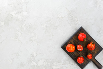 Ugly rotten tomatoes on a light background.