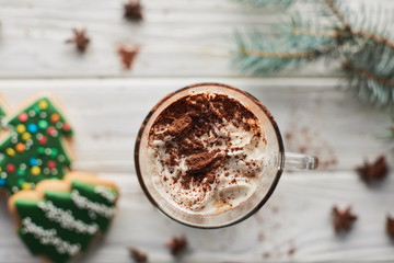 Obraz na płótnie Canvas selective focus of Christmas cacao with cacao powder and whipped cream in mug
