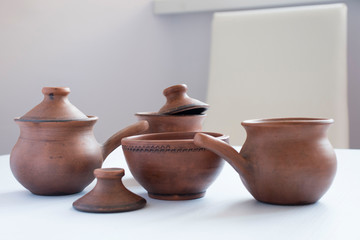 clay dishes on a white table