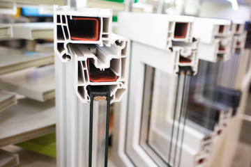Samples of modern window profiles at the hardware store. Installation service