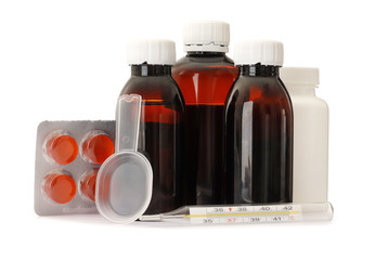 three amber glass bottle of Brown mixture for relieves cough, with pills and thermometer Clipping path. isolated on white background
