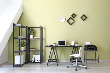 Interior of modern room with comfortable workplace