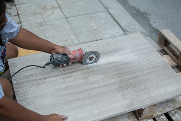 worker cutting  marble in construction site