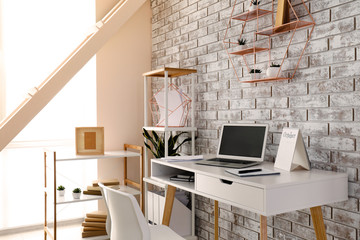 Interior of modern room with comfortable workplace