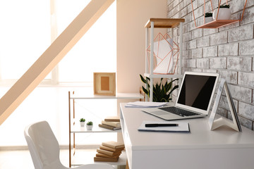 Interior of modern room with comfortable workplace