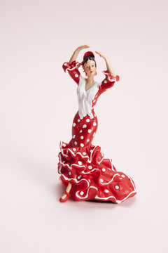 flamenco dancer figurine on a pop pink background