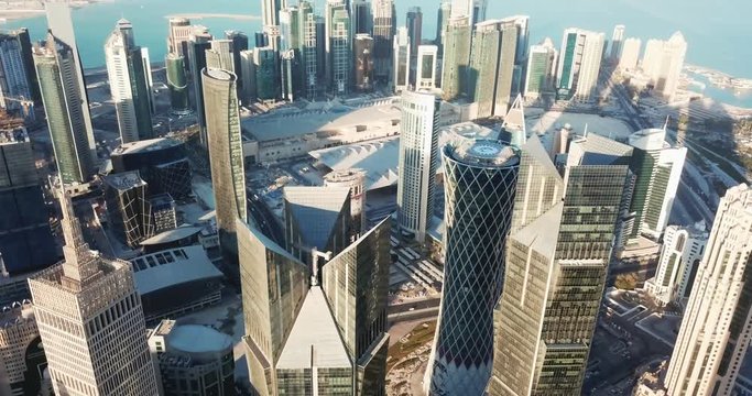 Aerial view of skyscrapers and towers in Doha at sunset, a middle east futuristic global city, West Bay business district, Qatar