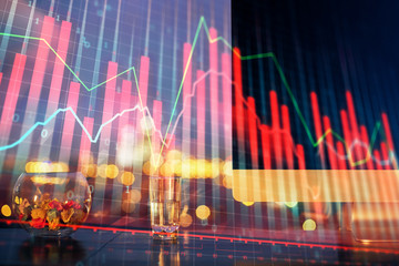 Financial graph colorful drawing and table with computer on background. Multi exposure. Concept of international markets.