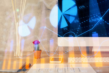 Forex Chart hologram on table with computer background. Multi exposure. Concept of financial markets.