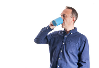 Man in casual blue shirt with blue cup of coffee on white background