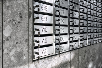 Numbered metal mailboxes with keys in them