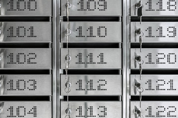 Numbered metal mailboxes with keys in them