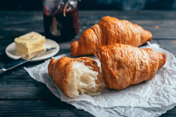 delicious croissants on wooden table