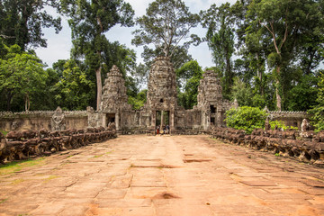 Fototapeta na wymiar One of the entrances to the ruined Temples in Angkor Wat, Cambodia