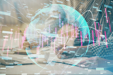 Fototapeta na wymiar Multi exposure of forex chart with man working on computer on background. Concept of market analysis.