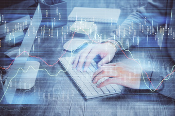 Double exposure of financial graph with man works in office on background. Concept of analysis.