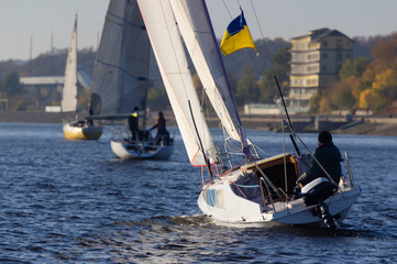 Fototapeta premium People on sailing boat on the river