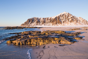 Evening mood at beautiful beach on Lofoten islands in winter