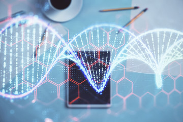 Double exposure of DNA hologram on digital tablet, table background. Concept of education