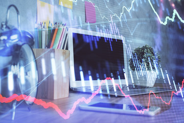 Forex market chart hologram and personal computer background. Multi exposure. Concept of investment.