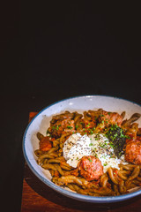 pasta with Smoked Duck, Rosemary Meatballs, Beef Bacon Bits, Black Truffle Pate, Salt Cured Egg Yolk, Truffle Oil, Roasted Red Pepper Sauce.