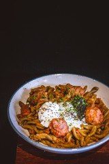 pasta with Smoked Duck, Rosemary Meatballs, Beef Bacon Bits, Black Truffle Pate, Salt Cured Egg Yolk, Truffle Oil, Roasted Red Pepper Sauce.