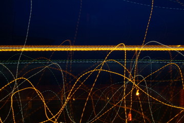 Light graffiti on background of blue sky