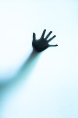 Abstract and spooky defocused hand.