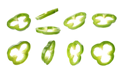 Set with slices of fresh green bell peppers on white background