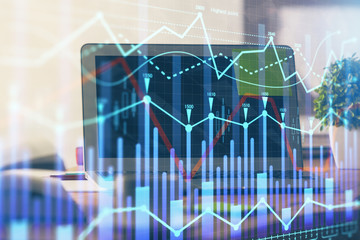 Forex market chart hologram and personal computer background. Double exposure. Concept of investment.