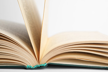 Closeup view of open book on white background