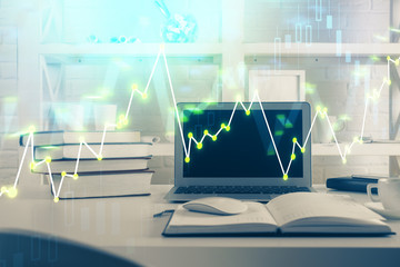 Stock market graph on background with desk and personal computer. Double exposure. Concept of financial analysis.