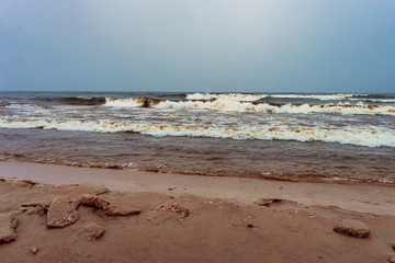 spume of the harsh waves coming to the shore