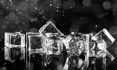 Cool cold ice cubes on dark abstract background
