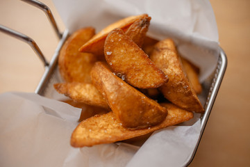 French fries on wooden table
