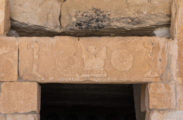 Ancient  bas-relief above the entrance to the Roman era burial chamber on the ruins of the...