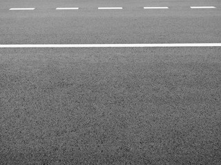 Fototapeta premium lane of asphalt road with white line