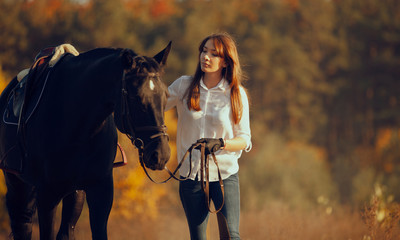 Obraz premium Young girl riding a horse.