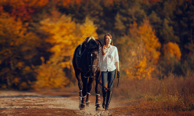 Young girl riding a horse.