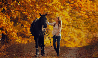 Young girl riding a horse.