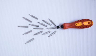 Hand screwdrivers and screws isolated on white background. Top view.