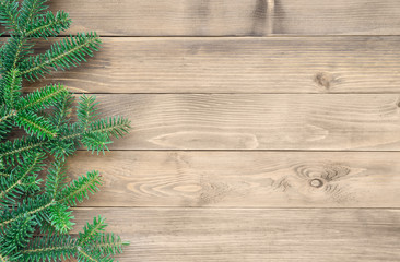 Christmas fir tree on a wooden background