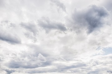 Dramatic sky. White and gray fluffy clouds
