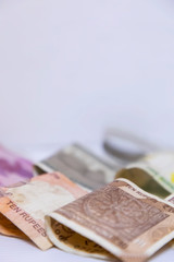 Indian currency bank notes of 10, 20 rupees, Indian currency note Folded on white background with space for text