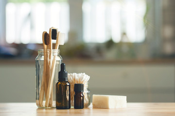 Set of eco-friendly plastic-free body care items in the minimalistic interior. Copy space. Zero waste concept, plastic-free, organic, eco-friendly shopping
