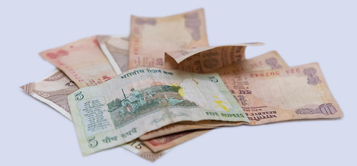 Fototapeta premium Closeup of brand new colorful Indian currency bank notes of 5 and 10, 20 rupees