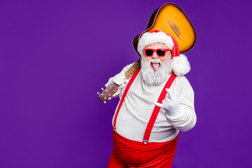 Portrait of his he nice naughty cheery glad cheerful cool bearded thick fat Santa carrying guitar...