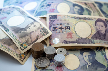 Japanese yen notes and Japanese yen coins for money concept background