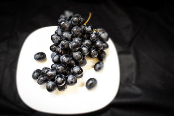 black grapes in a bowl