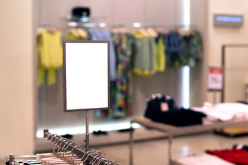 Mock up template of sales information banner or tag price in clothing store. Frame with copy space.